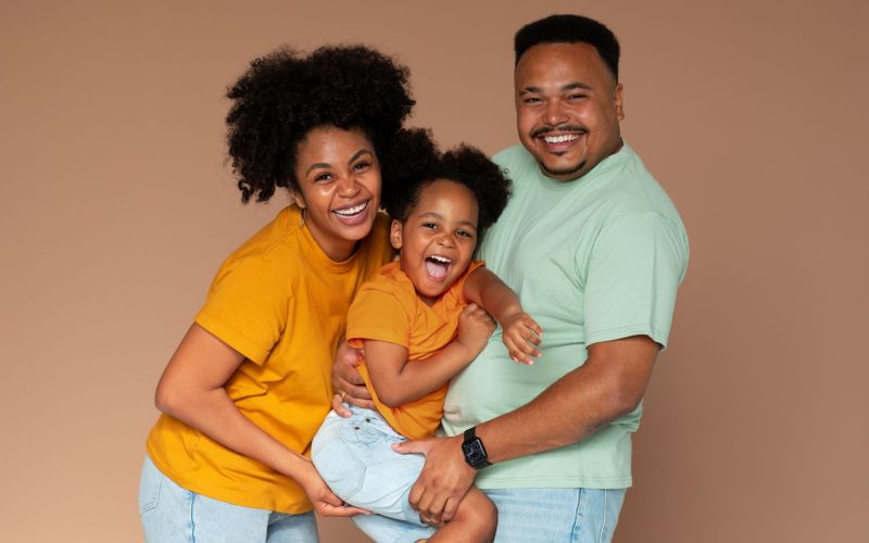 front-view-black-family-posing-studio (1) (1)